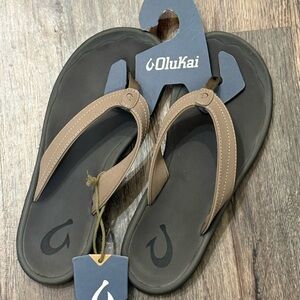 OluKai Tan and Black Flip Flops